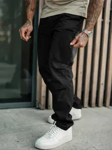 Men’s sports casual pants with multiple pockets, drawstring adjustable waistband; suitable for sports, work, and casual wear. Men’s stylish cargo pants with multiple pockets, made from comfortable, durable fabric, ideal for summer.