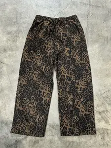 Unisex street style leopard-print full-length pants with a relaxed fit, drawstring waistband, comfortable and casual design. Perfect for casual daily wear, stylish and sensual leopard prints suitable for hip-hop, school events, parties, and commuting.