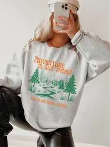 "Adventure Is Out There But So Are Serial Killers" Graphic Tee – Unisex Relaxed Fit, Printed in the USA Comfort Cotton Womenswear Check Flat Green