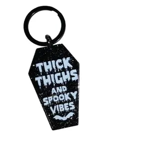 Thick Thighs & Spooky Vibes Coffin Shaped Black Glittery Keychain