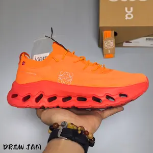 Cloud cushion running sneakers feature hollow segmented shock-absorbing foam outsole, crafted from ultra-breathable woven knit mesh, vibrant orange-red two-tone gradient design, lightweight slip-on fit