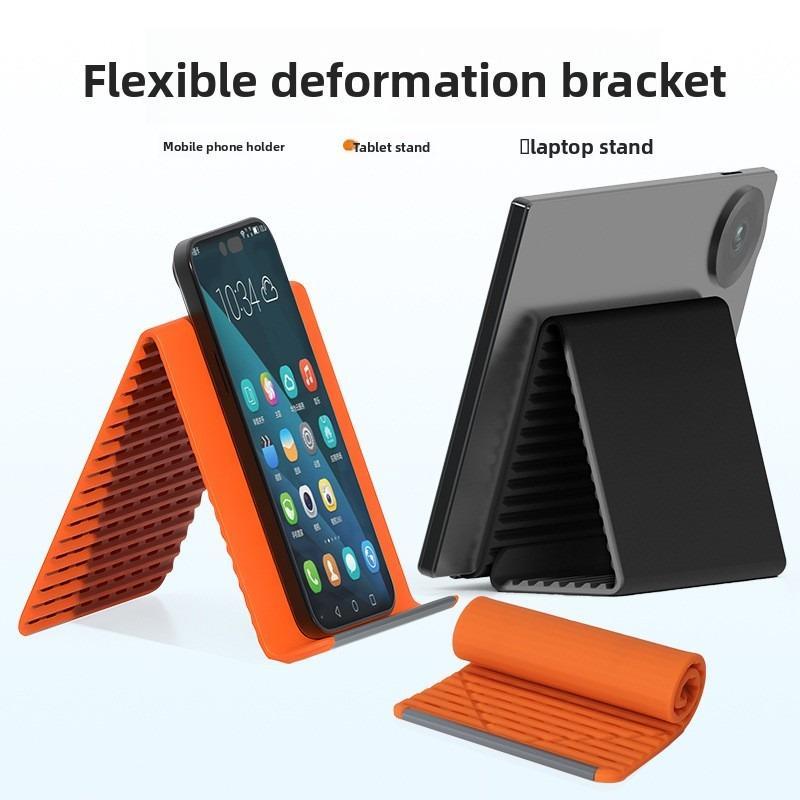Multifunctional silicone folding mobile phone stand – ideal for frequent users of digital devices. Suitable for use on office desks, in the kitchen for following recipes, for portable storage whilst travelling, and as a non-slip mount in the car.