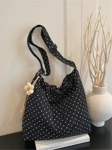 Wave dot printed crossbody bag with hanging accessories | Made of navy blue and white wave dot nylon fabric, with drawstring drawstring and floral hanging accessories, it has a large capacity and no burden. It is perfect for pairing with T-shirts, dresses