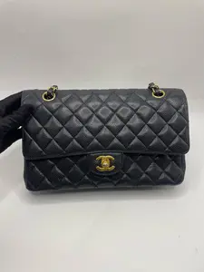 Pre-owned CHANEL Classic Flap Small – Black Caviar Leather with Gold Hardware. Series 19 (2014) Shows normal signs of use. Classic double flap with signature quilted pattern. Size: 15.5 × 25.5 × 6.5 cm.