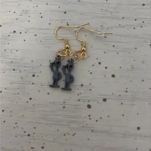 Grey alien earrings