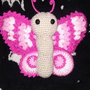 Crochet Butterfly Plushy - Soft Pink and White Amigurumi Toy with Large Black Eyes and Curled Antennae