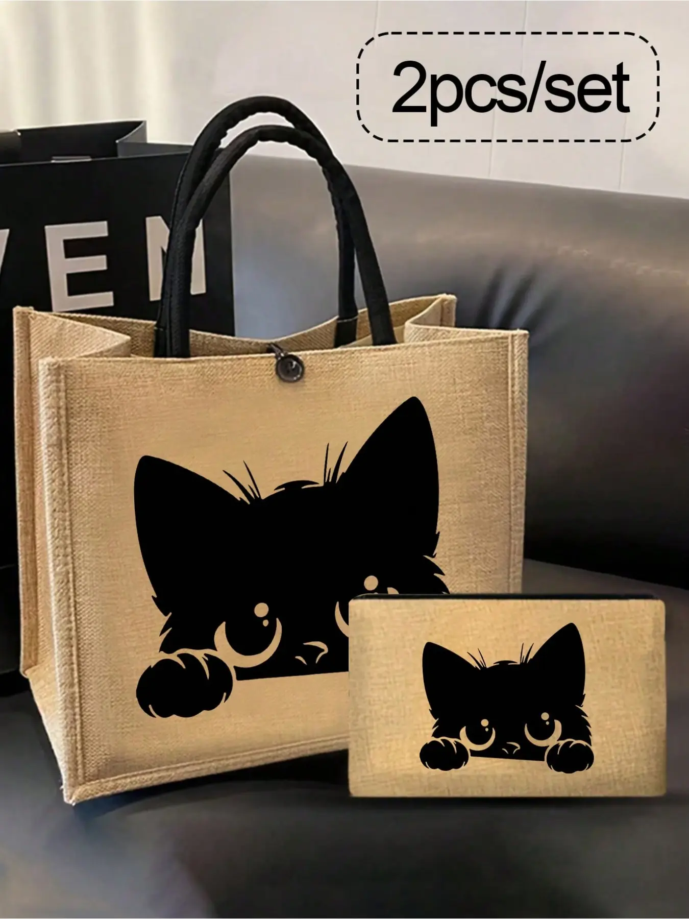 Cat-Themed Handbag Set: Women's handbag set, including a black tote bag with a cartoon cat pattern and a small bag/coin purse featuring cat, bird, waves, and flower designs.