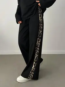 A women's black casual leopard print patchwork wide-leg pants, Casual Lounge Pants, high-waisted, slimming, and draping leisure pants suitable for all seasons, perfect for home, indoor, and outdoor wear