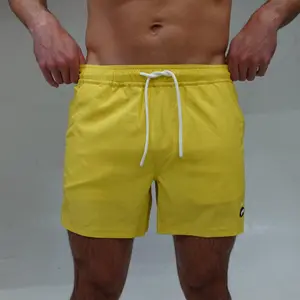 Jetties Men's Athletic Swim Shorts – No Mesh Liner, Solid Yellow