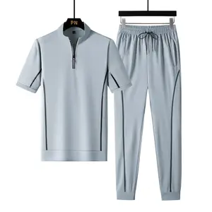 Men's set includes a half-zip top and matching joggers, regular fit, color-contrast side design, functional elastic cuffs, adjustable drawstring waistband, casual sportswear