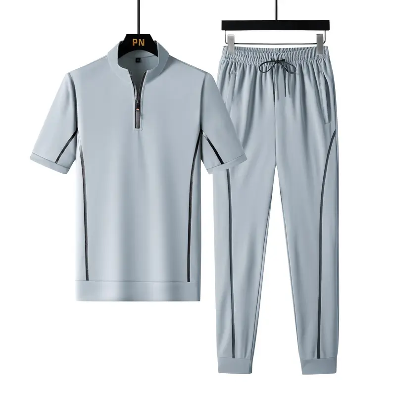 Men's set includes a half-zip top and matching joggers, regular fit, color-contrast side design, functional elastic cuffs, adjustable drawstring waistband, casual sportswear Streetwear Tracksuit Set Sweatsuit Set