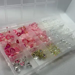Assorted Pink Nail Charms in Clear Storage Box - Variety of Designs and Shapes for Nail Art Decorations