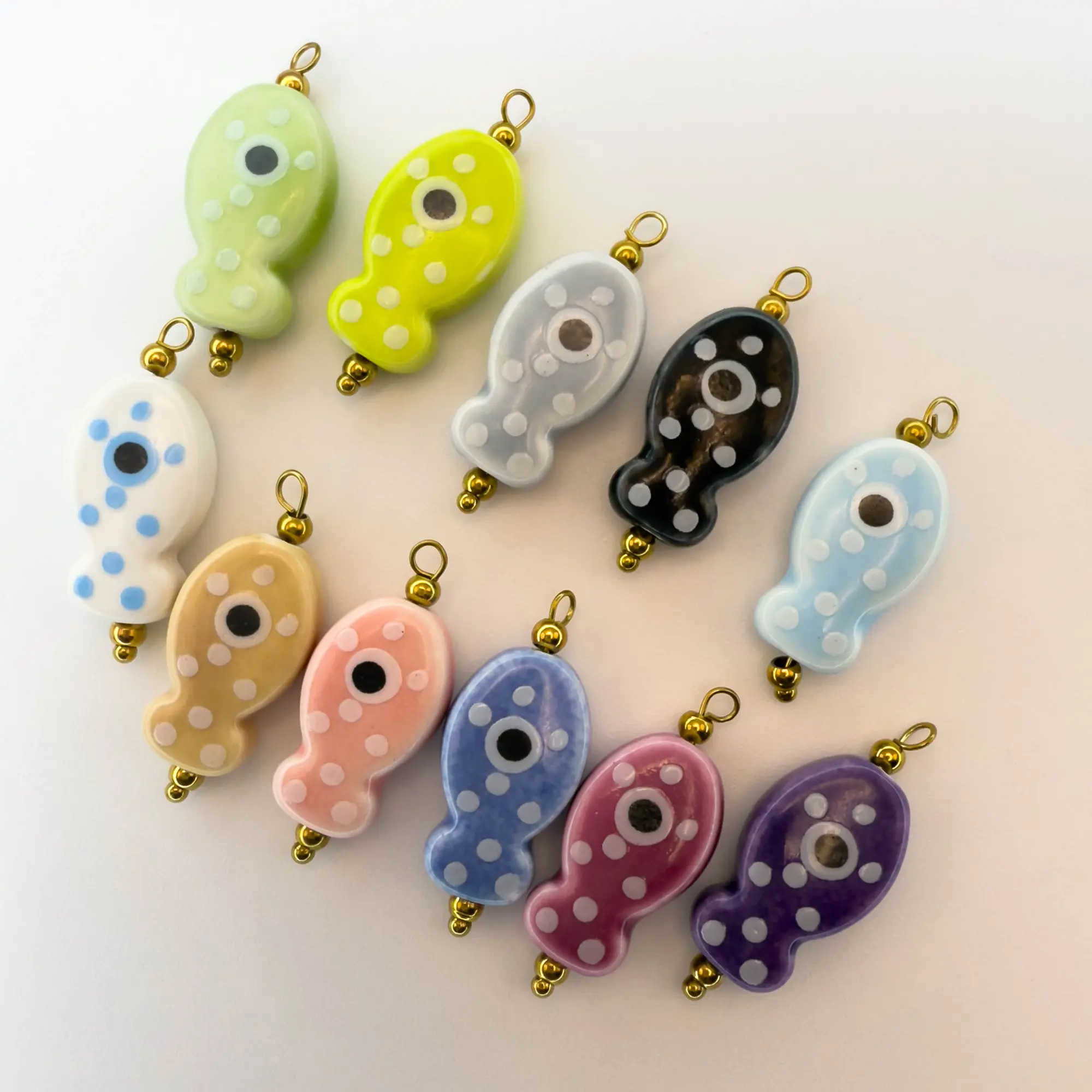 Hand-painted ceramic fish pendants with colorful polka dots are ideal for DIY necklaces, earrings, and jewelry accessories.