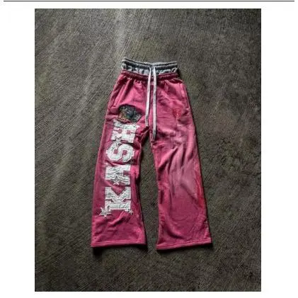 Two pairs of pink pants (embroidered wit
