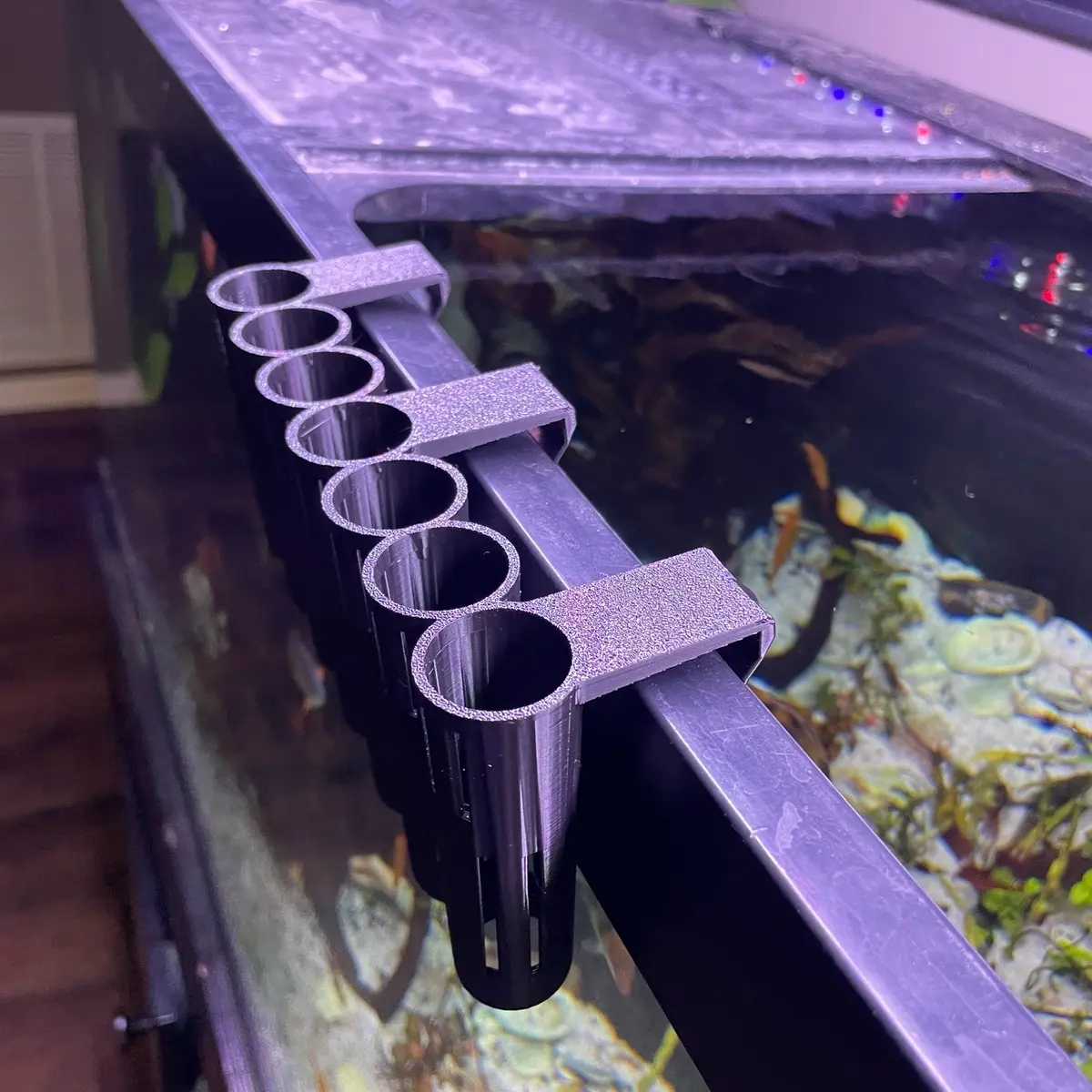 Multi stem plant holder for fish tank propagation and aquaponics