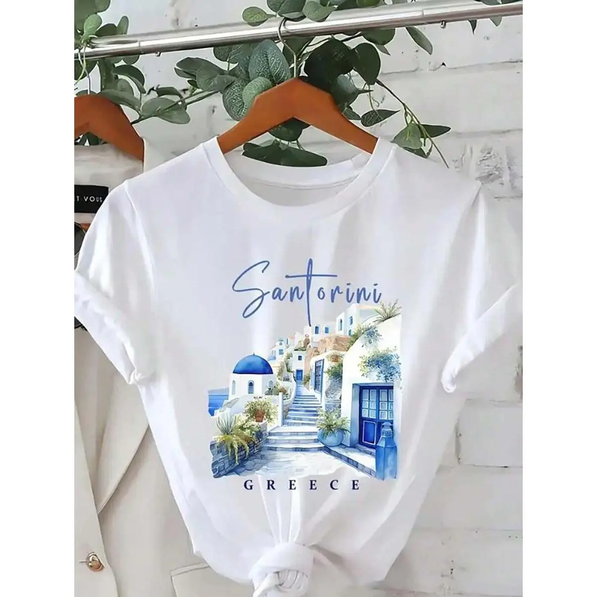 Women's Santorini Greece Pattern Printed T-Shirt - White Short Sleeve Casual Crew Neck Top, With Blue Domed Roofs And Lush Greenery Design, Lightweight Spring/Summer Travel Souvenir, Single's Party Gift, Spring Casual Wear | Vibrant Graphic Tee