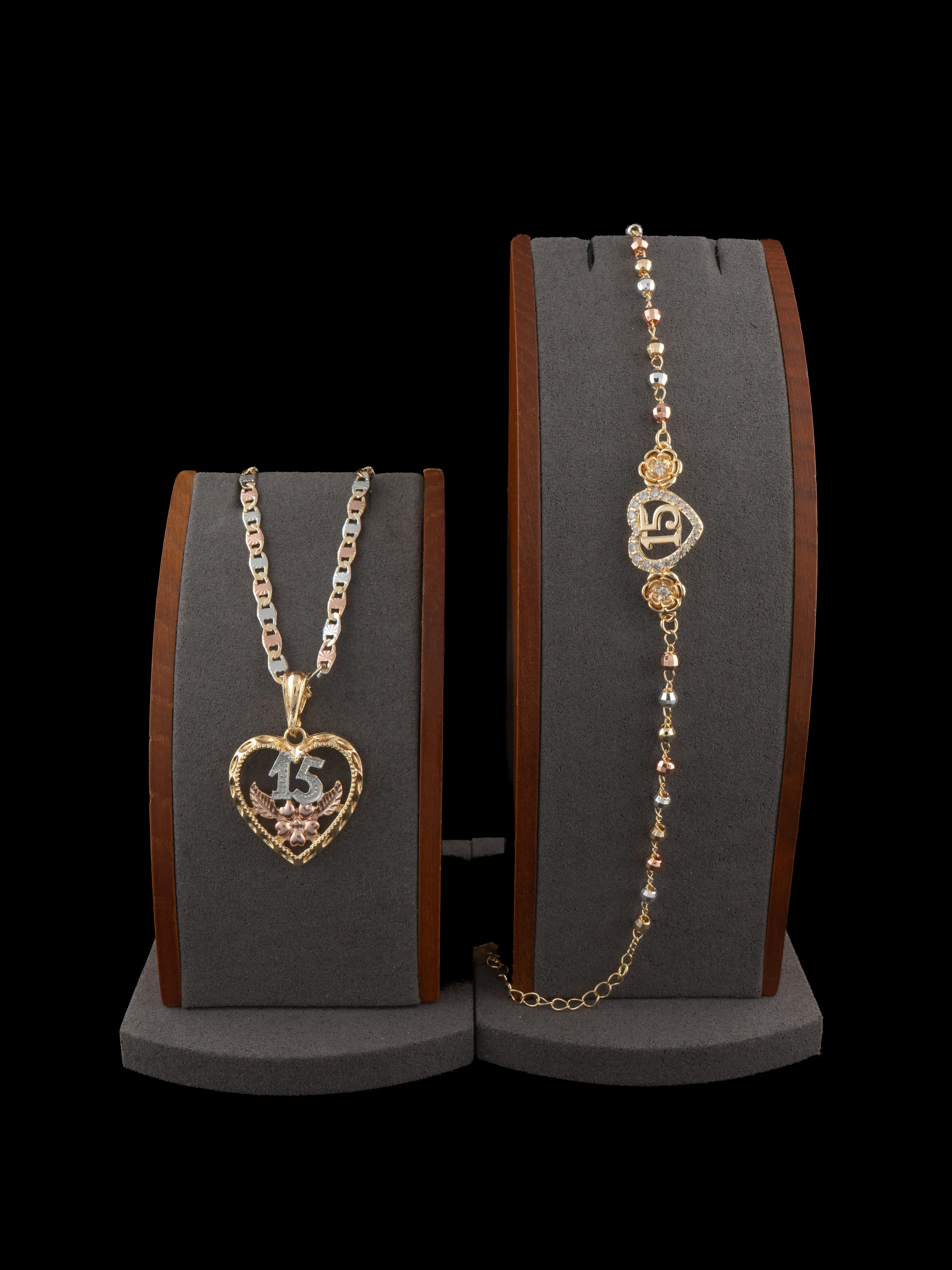 New "15 Años" pendant and 7.5-inch bracelet set in tri-color gold-filled metal; includes a 20- or 24-inch chain.