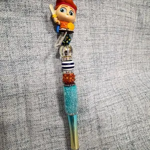 Doorables Beaded Pen with Decorative Beads, Orange and Blue, Featuring Character Figure and Decorative Element