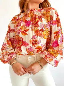 A ladies' orange floral print semi-collared long-sleeved shirt with frilly sleeves, featuring a vacation, fresh and sweet style.