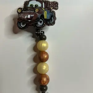 Tow Mater Badge Reel with Beaded Design and Cartoon Character