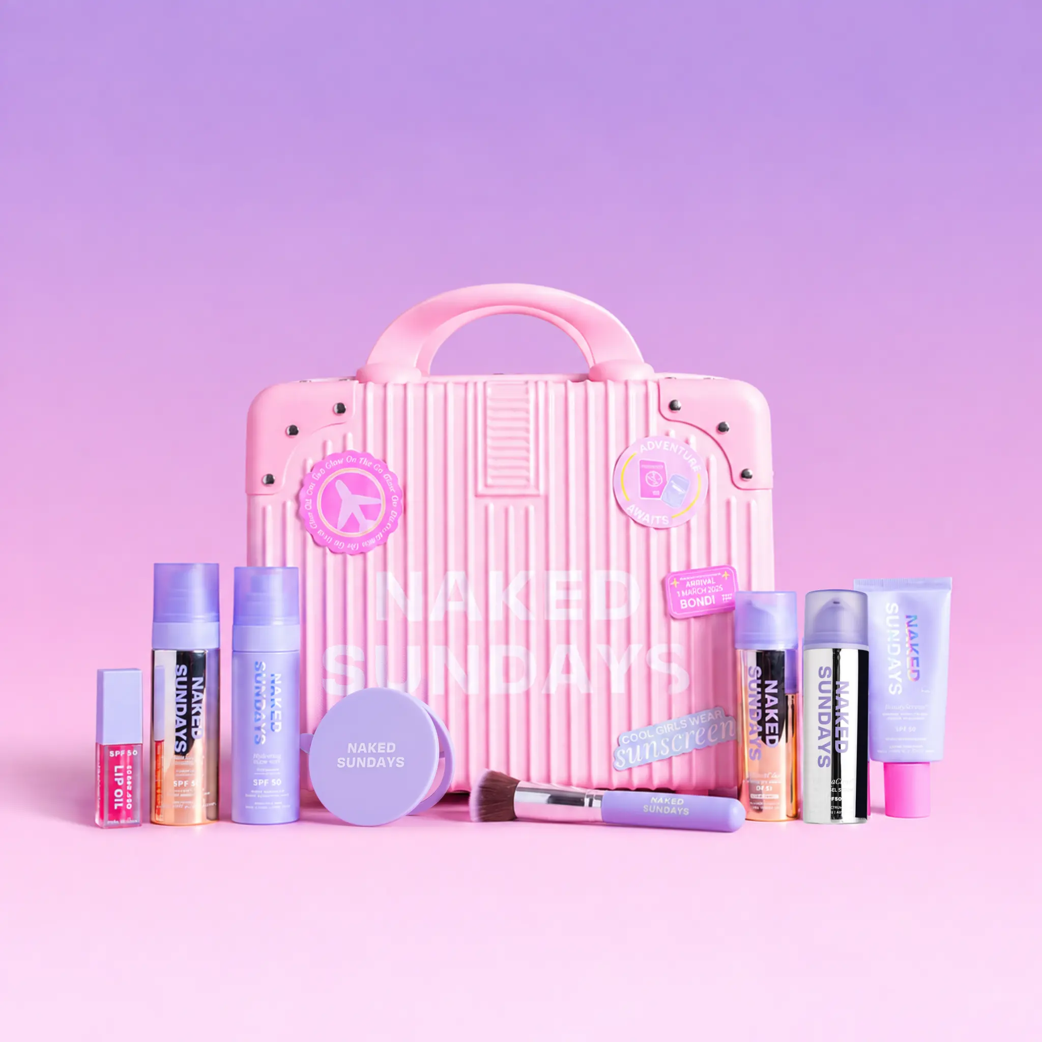 First Class Jetsetter Beauty Bundle Kit - Mini Exclusive Pink Suitcase plus Naked Sundays bestselling SPF and Skincare products  (SAVE 60%)