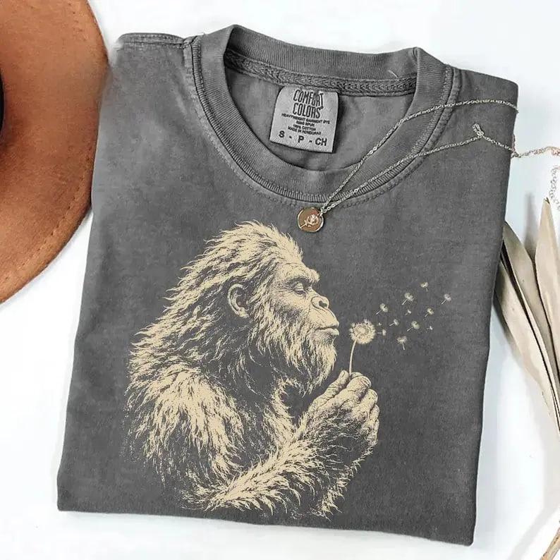 Men’s Loose-Fitting Short-Sleeve Crew Neck Comfort Colors Dandelion Tee – Vintage Washed Woodland Cryptid, Smoking Trout Graphics, Street Style, Outdoor Fishing Top, Father’s Day Gift, Inside-Out Recommended Cold Wash Tee