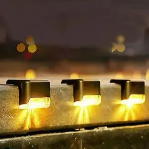 4 PCS Solar-powered step lights, garden courtyard decorative wall lights, outdoor waterproof staircase fence lights, automatically turn on when it gets dark.