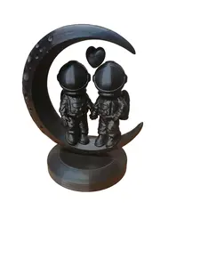 Astronomical Love Figurine - Black Moon Design with Heart Shape and Two Figures - Detailed Decorative Piece for Home Decor