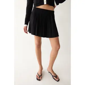 PLEATED KNIT MINI SKIRT