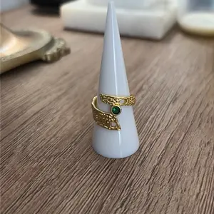 Adjustable Fold Filled Ring with Green Stone and Gold Color Design