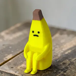 1 “Anxious Banana” Figurine - An emotion-themed desktop decoration featuring a banana in an anthropomorphic sitting pose; a collectible figurine perfect for Easter decorations and spring home decor