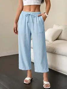 Women’s lightweight 9/10 pants—comfortable for home wear with a drapey feel, elastic waistband with drawstring and side pockets; versatile casual style that works for beach and vacation outfits—an essential piece for summer.