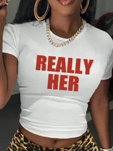 REALLY HER' Bold Slogan White Crop Top | Casual Y2K Streetwear Top | Premium Cotton Fabric | Bold Confident Statement Aesthetic | Trendy Slim-Fit Cropped Cut | Eye-Catching Red Text Print | Versatile Daily Wear | Perfect for Y2K/Confident Style Fans