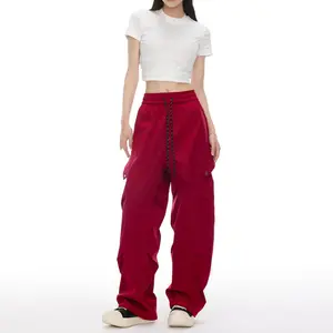 Women’s cargo pants — fashionable, structured design; high waist, wide legs, multiple pockets; loose straight cut with elastic waistband, casual trousers.