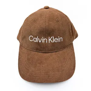 Calvin Klein Corduroy Baseball Cap - Soft Fabric, Curved Brim, Adjustable Strap, Subtle Logo, Unisex Style for Everyday Wear