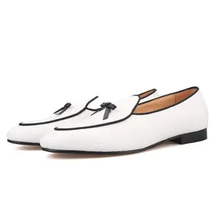 Custom made men's loafers with a two-color cotton canvas and a leather bow tie in fashion for weddings, parties and other occasions