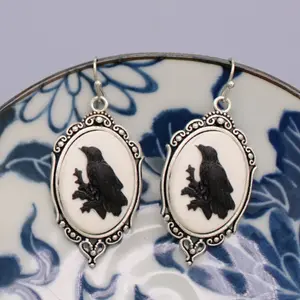 Regal Raven Silver Cameo Earrings - Elegant Design with Unique Style