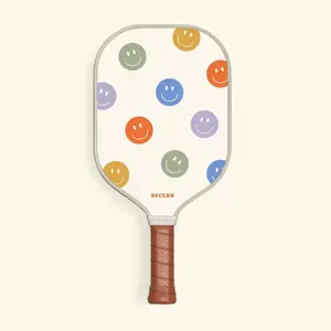 RECESS Optimist Pickleball Paddle with Colorful Smiley Face Design and Brown Grip