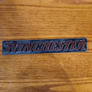 Winchester cast iron sign.