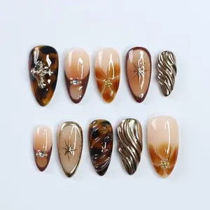 Fall Press On Nails with Tortoise Shell and Gold 3D Accents, Medium Almond Brown and Nude Nails with Starburst and Textured Chrome Design