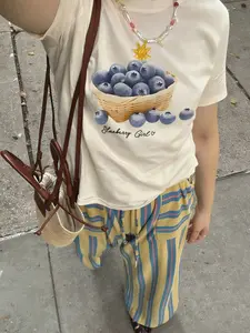 Blueberry Girl' Basket Blueberry Beige Short-Sleeve T-Shirt | Casual Fruit Lover Streetwear Top | Premium Cotton Fabric | Bold Fresh Fruit Aesthetic | Trendy Cropped-Fit | Eye-Catching Blueberry Basket Print | Versatile Daily Wear | Perfect for Fruit