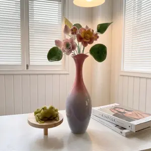 This minimalist ceramic vase set is cleverly designed and perfect for home and office flower arranging, desktop decoration, and room décor. Each vase contains ceramic flowers. A modern gradient ceramic vase is also available.