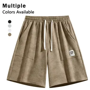 Men’s waffle knit casual shorts with elastic waistband and drawstring, loose and comfortable with pockets—breathable summer home loungewear shorts that are versatile for everyday wear and the beach.