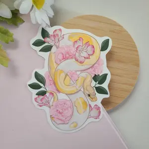 Ball python snake with pink sticker