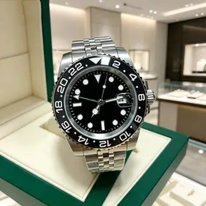 This black GMT-style watch is my new go-to - the rotating bezel and sleek silver band hit that perfect sport-luxury vibe.