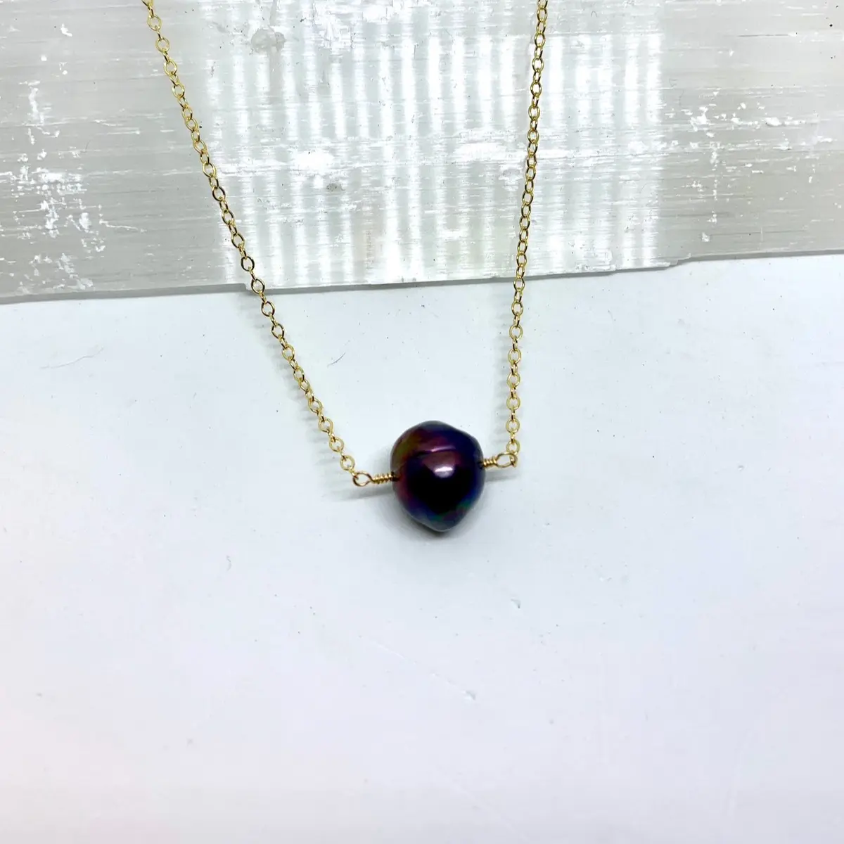 Single black pearl necklace