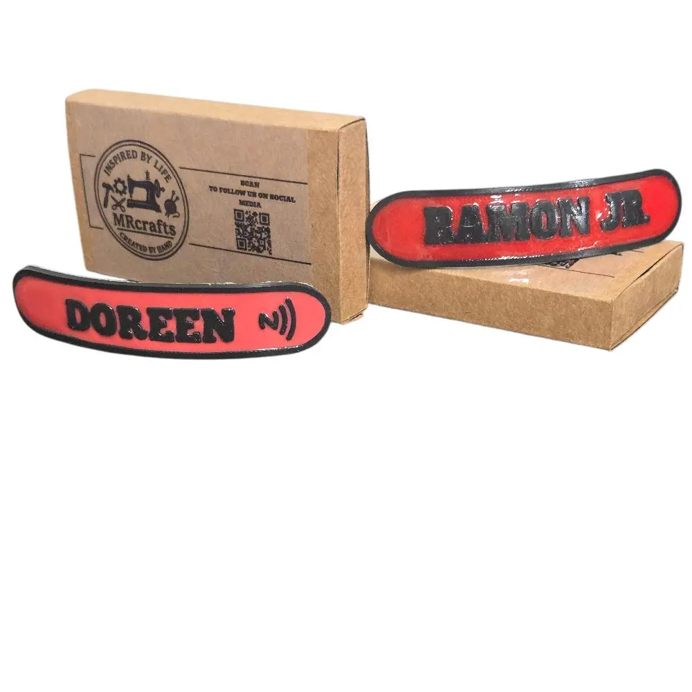 3-D printed custom name tags for hard hat. 3-D printed custom name tags for hard hat.
