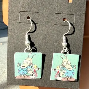 90's Cartoon Earrings - Square Design with Character Illustration from the 90s Era