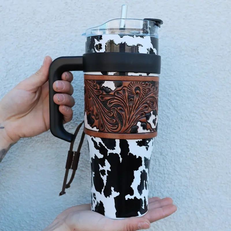 Wide Wyoming Tooled Tumbler - Drinkware Bottle with Unique Cow Print Design and Leather Wrap Handle