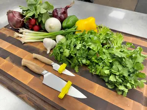 iSchwipe From Souza Innovation Is a Revolutionary Kitchen Tool That Easily and Safely Removes Food from a Knife Blade While Prepping.  Keep Your Hands from Smelling Like Onion or Garlic While keeping Your Fingers Away from the Sharp blade. Knives